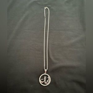 Round “Amal” name